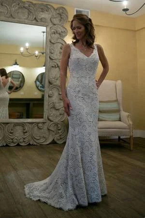 Wedding Dresses with Satin Trimmed Collar and Ruffled Hem and Bow at the Waist for a Classic and Girly LookAlvina Valenta Ti Adora Wedding Dresses with Satin Trimmed Collar and Ruffled Hem and Bow at the Waist for a Classic and Girly LookAlvina Valenta Ti Adora