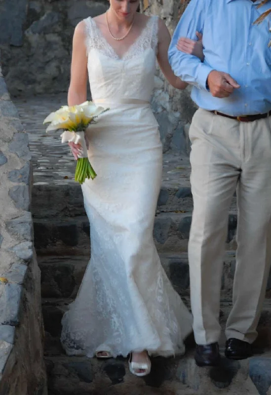 Wedding Dresses with Embroidered Floral Patterns and Tassel Hem and Sequined Bodice and Satin Sash and Belt for a Bohemian and Glamorous LookAmy Kuschel Lauryn Wedding Dresses with Embroidered Floral Patterns and Tassel Hem and Sequined Bodice and Satin Sash and Belt for a Bohemian and Glamorous LookAmy Kuschel Lauryn
