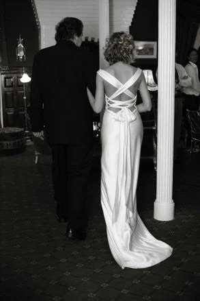 Wedding Dresses with Ruffled Sleeveless Top and Sequined Bodice and Tulle Skirt and Beaded Waistband and Bow at the Back for a Dramatic and Glamorous LookAmy Michelson Ballet Wedding Dresses with Ruffled Sleeveless Top and Sequined Bodice and Tulle Skirt and Beaded Waistband and Bow at the Back for a Dramatic and Glamorous LookAmy Michelson Ballet