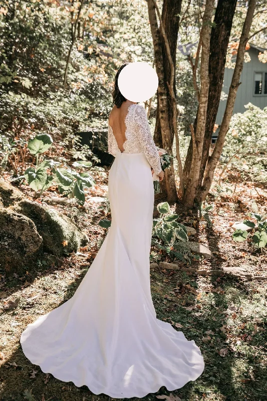 Wedding Dresses with Sheer Sleeve and Sequined Cuffs and Embroidered Bodice and Bow at the Waist for an Elegant and Sparkly LookAnais Anette Rae Long Sleeved Mermaid Wedding Dresses with Sheer Sleeve and Sequined Cuffs and Embroidered Bodice and Bow at the Waist for an Elegant and Sparkly LookAnais Anette Rae Long Sleeved Mermaid