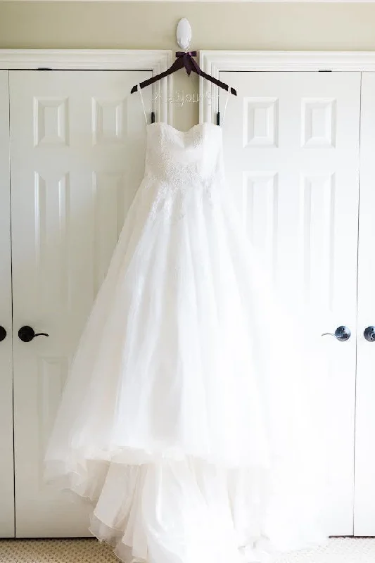 Wedding Dresses with Beaded Floral Wreath on the Bodice and Tulle Skirt and High Neck for a Delicate and Festive LookAnne Barge Swan Lake