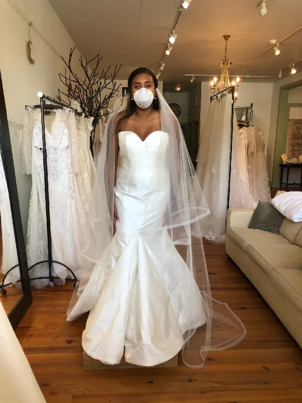 Wedding Dresses with High Neck and Embroidered Back and Sheer Sleeves for a Modest and Intricate LookAntonio Gual Erin with Custom Neckline Wedding Dresses with High Neck and Embroidered Back and Sheer Sleeves for a Modest and Intricate LookAntonio Gual Erin with Custom Neckline