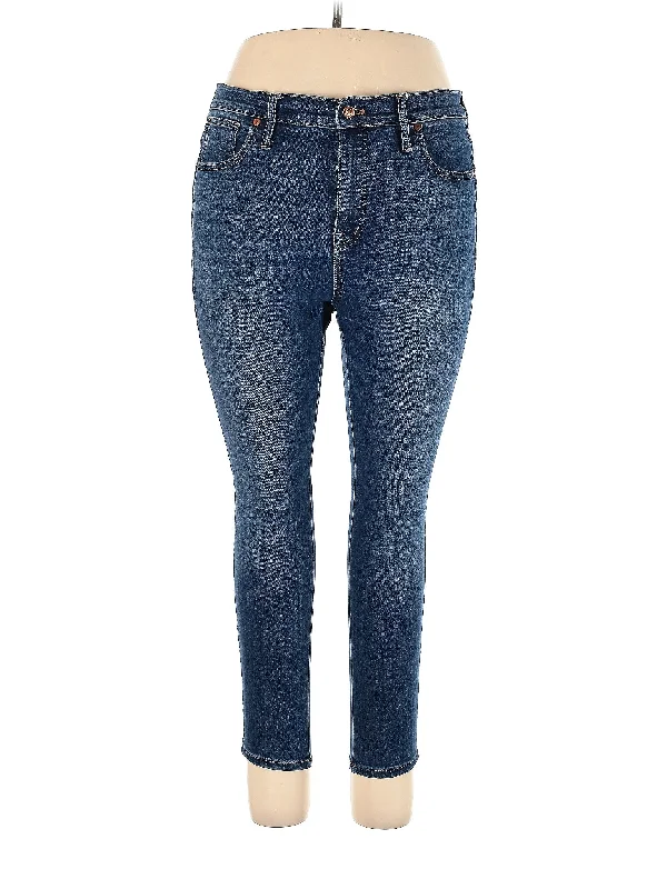 Ripped and torn denim jeans with multiple strategic holes for a rebellious styleHigh-Rise Skinny Jeans in Medium Wash