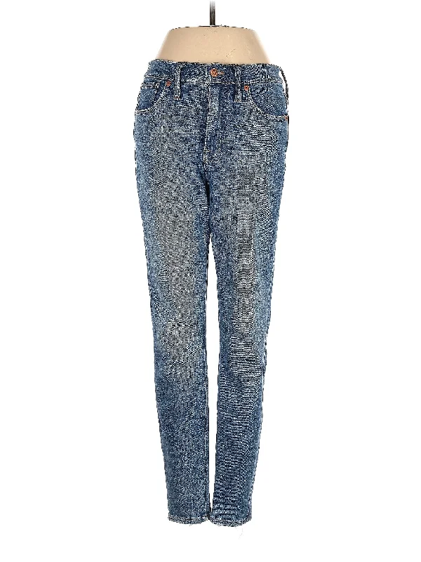 Ripped and torn denim jeans with multiple strategic holes for a rebellious styleMid-Rise Boyjeans Jeans in Medium Wash Ripped and torn denim jeans with multiple strategic holes for a rebellious styleMid-Rise Boyjeans Jeans in Medium Wash