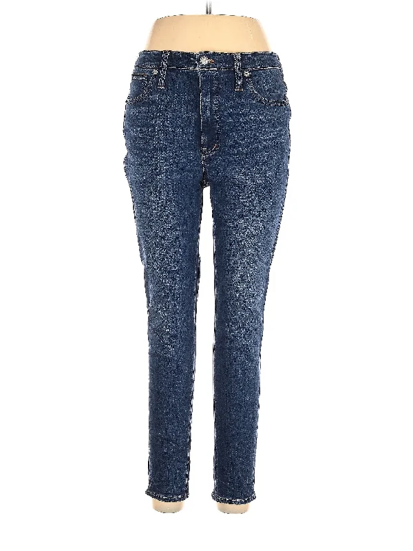Ripped and torn denim jeans with multiple strategic holes for a rebellious styleMid-Rise Skinny Jeans in Medium Wash