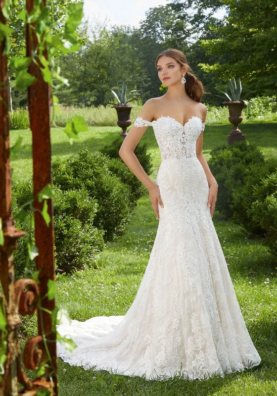 Wedding Dresses with Lace Insertions on the Skirt and Beaded Waistband and Ruffled Hem and Bow at the Waist and Embroidered Floral Patterns for a Feminine and Flirty LookMorilee 5714 - Size 12 Wedding Dresses with Lace Insertions on the Skirt and Beaded Waistband and Ruffled Hem and Bow at the Waist and Embroidered Floral Patterns for a Feminine and Flirty LookMorilee 5714 - Size 12