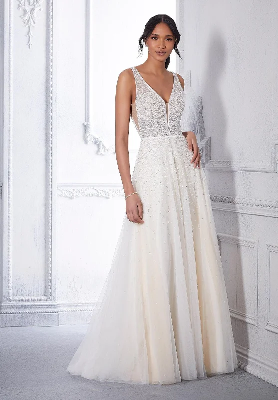 Wedding Dresses with Lace Insertions on the Skirt and Beaded Waistband and Ruffled Hem and Bow at the Waist for a Feminine and Flirty LookMorilee Crystal - Size 10 Wedding Dresses with Lace Insertions on the Skirt and Beaded Waistband and Ruffled Hem and Bow at the Waist for a Feminine and Flirty LookMorilee Crystal - Size 10
