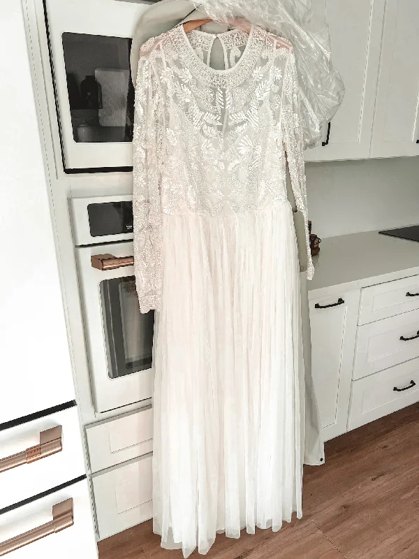 Strapless Wedding Dresses with Tassel Accents and Sequined Belt for a Fun LookOther Elizabeth Beaded Bodice Strapless Wedding Dresses with Tassel Accents and Sequined Belt for a Fun LookOther Elizabeth Beaded Bodice