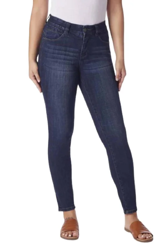 Trousers with decorative buttons for women in a stylish detailCecilia Skinny Mid-Rise Jeans In Night Breeze