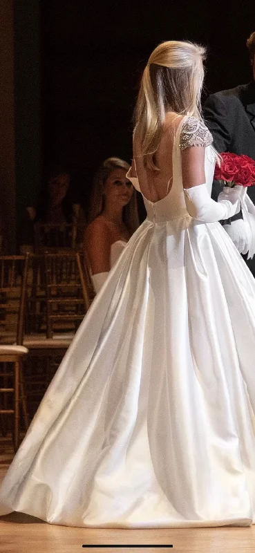 Wedding Dresses with Embroidered Birds and Sequined Floral Motifs and Satin and Lace Combo and Bow at the Waist and Embroidered Floral Patterns for a Nature Inspired and Romantic LookAlvina Valenta 9658 Wedding Dresses with Embroidered Birds and Sequined Floral Motifs and Satin and Lace Combo and Bow at the Waist and Embroidered Floral Patterns for a Nature Inspired and Romantic LookAlvina Valenta 9658