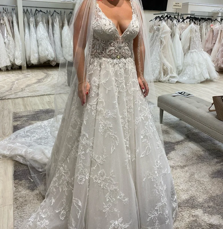 Wedding Dresses with Ruffled Sleeveless Top and Sequined Bodice and Tulle Skirt and Beaded Waistband and Bow at the Back and Embroidered Floral Patterns for a Dramatic and Glamorous LookAmalia Carrara 362 Wedding Dresses with Ruffled Sleeveless Top and Sequined Bodice and Tulle Skirt and Beaded Waistband and Bow at the Back and Embroidered Floral Patterns for a Dramatic and Glamorous LookAmalia Carrara 362
