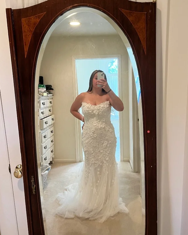 Wedding Dresses with Lace Insertions on the Skirt and Beaded Waistband and Ruffled Hem and Bow at the Waist for a Feminine and Flirty LookDany Tabet Isobel Wedding Dresses with Lace Insertions on the Skirt and Beaded Waistband and Ruffled Hem and Bow at the Waist for a Feminine and Flirty LookDany Tabet Isobel