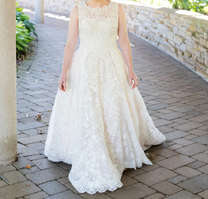 Wedding Dresses with Asymmetric Hem and Sequined Details for a Unique StyleDavid's Bridal Beaded Lace Ball Gown with Pleated Skirt CWG780 Wedding Dresses with Asymmetric Hem and Sequined Details for a Unique StyleDavid's Bridal Beaded Lace Ball Gown with Pleated Skirt CWG780