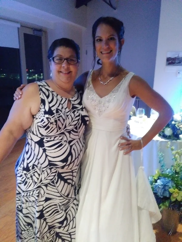 Wedding Dresses with Embroidered Tribal Patterns and Satin Sash and Beaded Waistband and Tulle Skirt for a Cultural and Stylish LookDavid's Bridal V3806 Wedding Dresses with Embroidered Tribal Patterns and Satin Sash and Beaded Waistband and Tulle Skirt for a Cultural and Stylish LookDavid's Bridal V3806