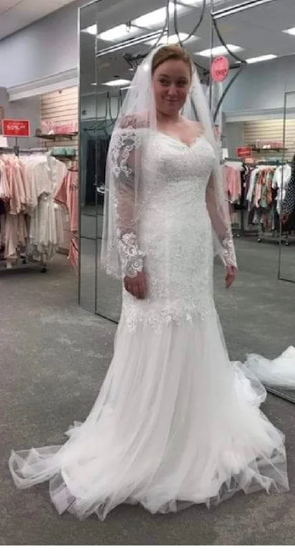Wedding Dresses with Sheer Sleeve and Sequined Cuffs and Embroidered Bodice and Bow at the Waist for an Elegant and Sparkly LookDavid's Bridal WG3943 Wedding Dresses with Sheer Sleeve and Sequined Cuffs and Embroidered Bodice and Bow at the Waist for an Elegant and Sparkly LookDavid's Bridal WG3943