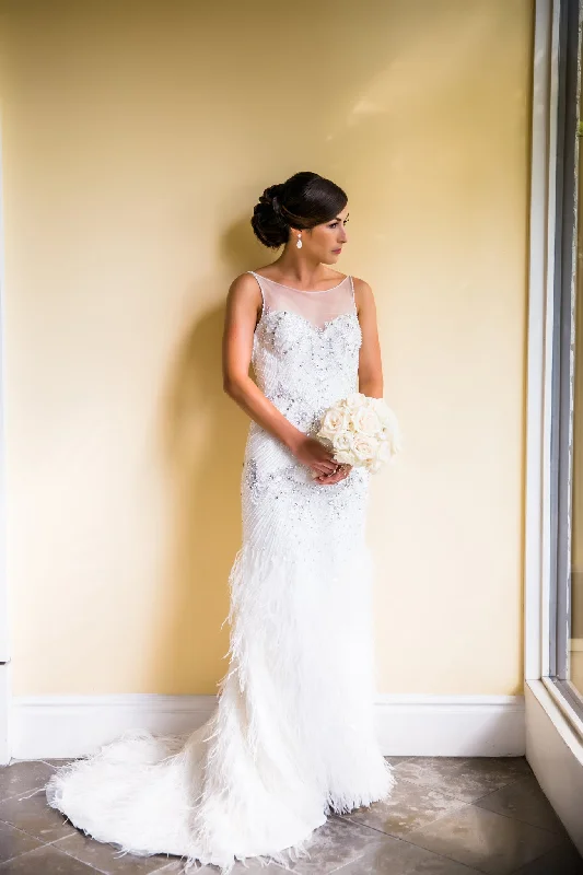 Wedding Dresses with Sheer Panels and Beaded Trim and Bow at the Back and Embroidered Paisley Patterns for a Sexy and Exotic LookDemetrios DP307 Wedding Dresses with Sheer Panels and Beaded Trim and Bow at the Back and Embroidered Paisley Patterns for a Sexy and Exotic LookDemetrios DP307