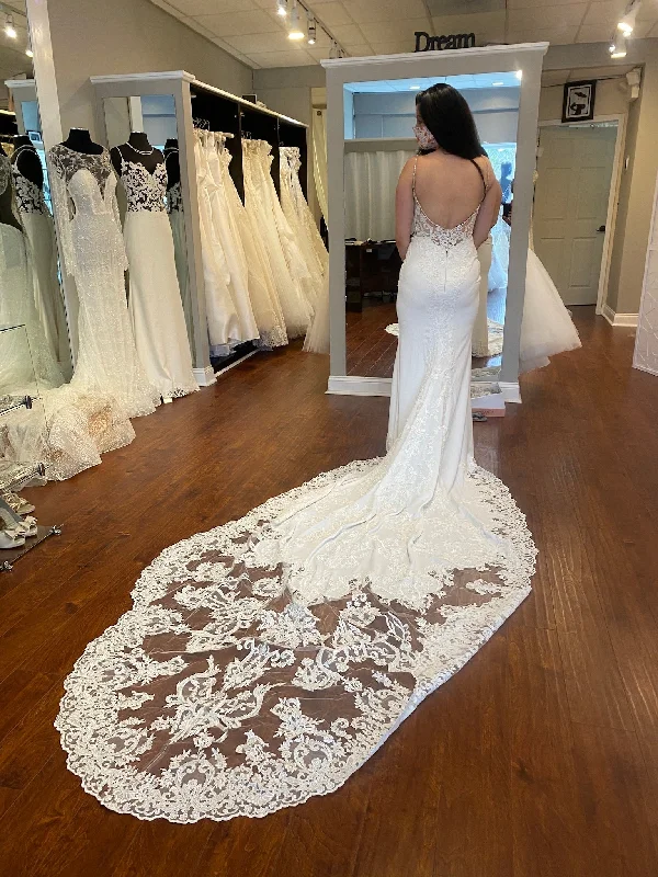 Wedding Dresses with High Low Sheer Skirt and Embroidered Birds and Sequined Floral Motifs for a Nature Inspired and Dramatic LookEnzoani McKinley Wedding Dresses with High Low Sheer Skirt and Embroidered Birds and Sequined Floral Motifs for a Nature Inspired and Dramatic LookEnzoani McKinley