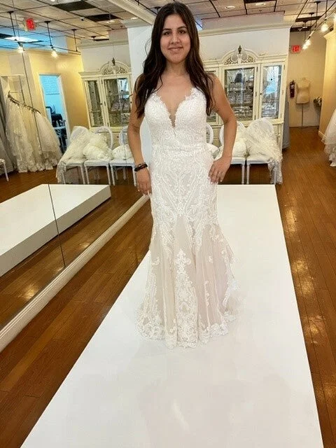 Wedding Dresses with Pleated Skirts and Lace Overlay and Bow at the Back for a Feminine and Timeless LookEnzoani Orsa Wedding Dresses with Pleated Skirts and Lace Overlay and Bow at the Back for a Feminine and Timeless LookEnzoani Orsa