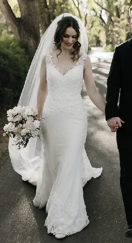 Wedding Dresses with Ruffled Sleeveless Top and Sequined Bodice and Tulle Skirt and Beaded Waistband and Bow at the Back and Embroidered Floral Patterns for a Dramatic and Glamorous LookLillian West 66012