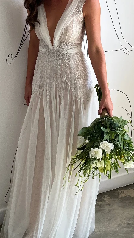 Wedding Dresses with Satin Trimmed Collar and Bow Back and Embroidered Skirt and Sequined Bodice and Belt and Embroidered Floral Patterns for a Classic and Glamorous LookLiz Martinez Marigold
