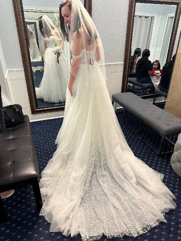 Wedding Dresses with Embroidered Tribal Patterns and Satin Sash and Beaded Waistband and Tulle Skirt and Belt for a Cultural and Glamorous LookMadison James Hopkins Wedding Dresses with Embroidered Tribal Patterns and Satin Sash and Beaded Waistband and Tulle Skirt and Belt for a Cultural and Glamorous LookMadison James Hopkins