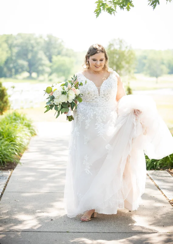 Wedding Dresses with Embroidered Birds and Sequined Floral Motifs and Satin and Lace Combo and Bow at the Waist for a Nature Inspired and Romantic LookMaggie Sottero Raphael Dawn Wedding Dresses with Embroidered Birds and Sequined Floral Motifs and Satin and Lace Combo and Bow at the Waist for a Nature Inspired and Romantic LookMaggie Sottero Raphael Dawn