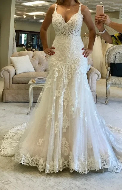 Wedding Dresses with Sheer Sleeve and Sequined Cuffs and Bow at the Waist and Embroidered Skirt and Belt and Embroidered Floral Patterns for an Elegant and Intricate LookMartina Liana 817