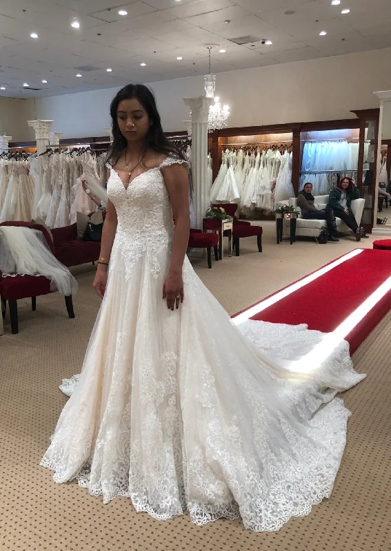 Wedding Dresses with Sequined Geometric Shapes and Lace and Chiffon Blend and Ruffled Sleeves and Belt for a Modern and Dramatic LookMartina Liana 955 Wedding Dresses with Sequined Geometric Shapes and Lace and Chiffon Blend and Ruffled Sleeves and Belt for a Modern and Dramatic LookMartina Liana 955