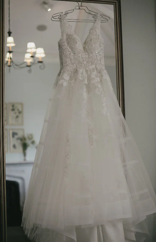 Wedding Dresses with Embroidered Stars and Sequined Dots and Sheer Sleeve and Belt and Embroidered Floral Patterns for a Celestial and Playful LookMichelle Roth Glory Wedding Dresses with Embroidered Stars and Sequined Dots and Sheer Sleeve and Belt and Embroidered Floral Patterns for a Celestial and Playful LookMichelle Roth Glory