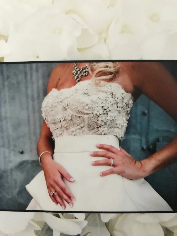 Wedding Dresses with Sequined Geometric Shapes and Lace and Chiffon Blend and Ruffled Sleeves and Belt and Embroidered Skirt for a Modern and Dramatic LookMonique Lhuillier Meringue Wedding Dresses with Sequined Geometric Shapes and Lace and Chiffon Blend and Ruffled Sleeves and Belt and Embroidered Skirt for a Modern and Dramatic LookMonique Lhuillier Meringue