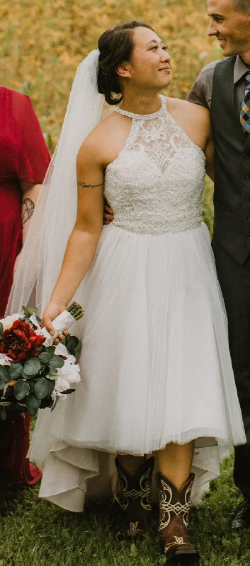 Wedding Dresses with Sheer Panels and Beaded Trim and Embroidered Paisley Patterns and Ruffled Hem and Belt for a Sultry and Exotic LookMori Lee Leilani 6898 Wedding Dresses with Sheer Panels and Beaded Trim and Embroidered Paisley Patterns and Ruffled Hem and Belt for a Sultry and Exotic LookMori Lee Leilani 6898