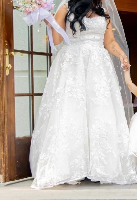 Wedding Dresses with Metallic Sequined Bodice and Chiffon Skirt and Ruffled Hem and Sheer Back for a Glamorous and Flirty LookOleg Cassini CWG958 Wedding Dresses with Metallic Sequined Bodice and Chiffon Skirt and Ruffled Hem and Sheer Back for a Glamorous and Flirty LookOleg Cassini CWG958