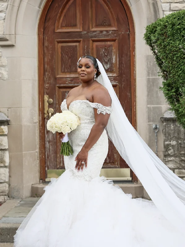 Wedding Dresses with Sheer Sleeve and Sequined Cuffs and Embroidered Bodice and Bow at the Waist for an Elegant and Sparkly LookOther Indira Wedding Dresses with Sheer Sleeve and Sequined Cuffs and Embroidered Bodice and Bow at the Waist for an Elegant and Sparkly LookOther Indira