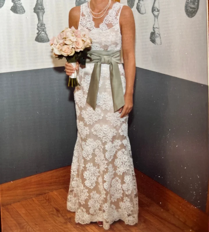 Wedding Dresses with Lace Insertions on the Skirt and Beaded Waistband and Ruffled Hem and Bow at the Waist and Embroidered Floral Patterns for a Feminine and Flirty LookOther Inspired by Jim Hjelm 8904 Wedding Dresses with Lace Insertions on the Skirt and Beaded Waistband and Ruffled Hem and Bow at the Waist and Embroidered Floral Patterns for a Feminine and Flirty LookOther Inspired by Jim Hjelm 8904