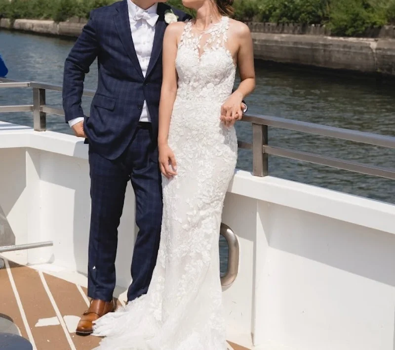 Wedding Dresses with Ruffled Sleeveless Top and Sequined Bodice and Tulle Skirt and Beaded Waistband and Bow at the Back and Embroidered Floral Patterns for a Dramatic and Glamorous LookPronovias Hati Wedding Dresses with Ruffled Sleeveless Top and Sequined Bodice and Tulle Skirt and Beaded Waistband and Bow at the Back and Embroidered Floral Patterns for a Dramatic and Glamorous LookPronovias Hati