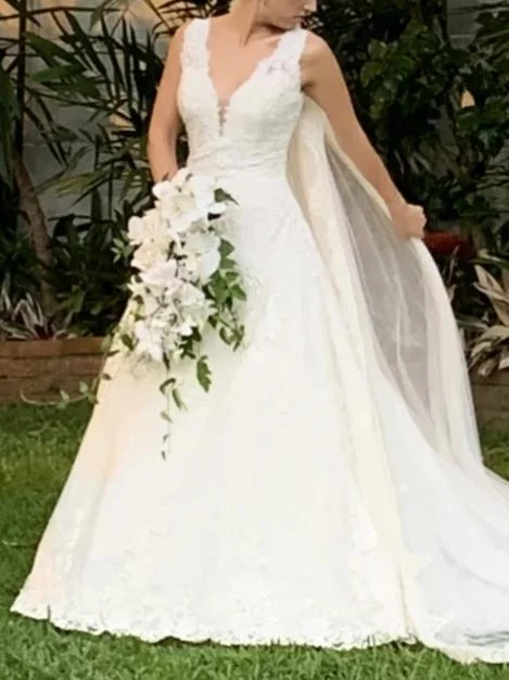 Wedding Dresses with Embroidered Stars and Sequined Dots and Sheer Sleeve and Belt and Embroidered Floral Patterns for a Celestial and Playful LookPronovias Maggie Wedding Dresses with Embroidered Stars and Sequined Dots and Sheer Sleeve and Belt and Embroidered Floral Patterns for a Celestial and Playful LookPronovias Maggie