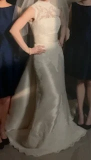 Wedding Dresses with Embroidered Floral Patterns and Tassel Hem and Sequined Bodice and Satin Sash and Belt for a Bohemian and Glamorous LookPronovias Ondra Wedding Dresses with Embroidered Floral Patterns and Tassel Hem and Sequined Bodice and Satin Sash and Belt for a Bohemian and Glamorous LookPronovias Ondra