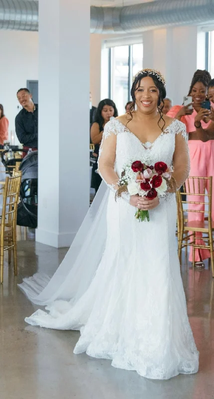 Wedding Dresses with Embroidered Tribal Patterns and Satin Sash and Beaded Waistband and Tulle Skirt and Belt for a Cultural and Glamorous LookPronovias Shirley Wedding Dresses with Embroidered Tribal Patterns and Satin Sash and Beaded Waistband and Tulle Skirt and Belt for a Cultural and Glamorous LookPronovias Shirley