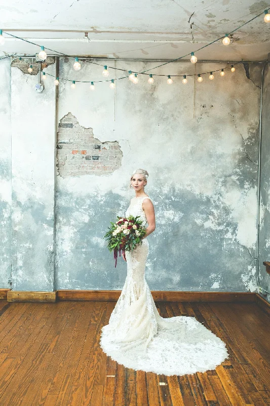 Wedding Dresses with Beaded Waistbands and Tiered Skirts and Lace Overlay for a Glamorous and Feminine LookPronovias Verna Wedding Dresses with Beaded Waistbands and Tiered Skirts and Lace Overlay for a Glamorous and Feminine LookPronovias Verna