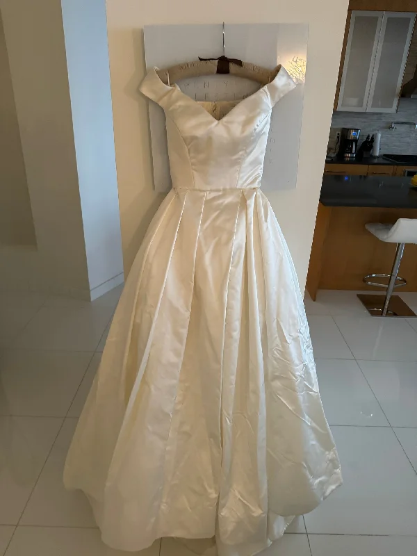 Wedding Dresses with Embroidered Stars and Sequined Dots and Sheer Sleeve and Belt for a Celestial and Playful LookReem Acra Good Grace