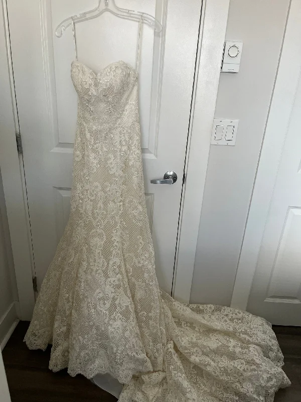 Wedding Dresses with Satin Trimmed Collar and Ruffled Hem and Bow at the Waist for a Classic and Girly LookSottero & Midgley Leona Wedding Dresses with Satin Trimmed Collar and Ruffled Hem and Bow at the Waist for a Classic and Girly LookSottero & Midgley Leona
