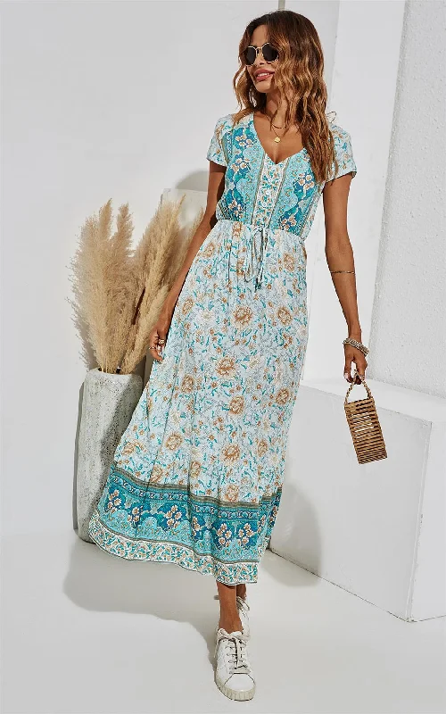 Backless midi dress for a sexy and glamorous appearanceGolden Floral Printed Tiered Midi Dress In Turquoise Blue